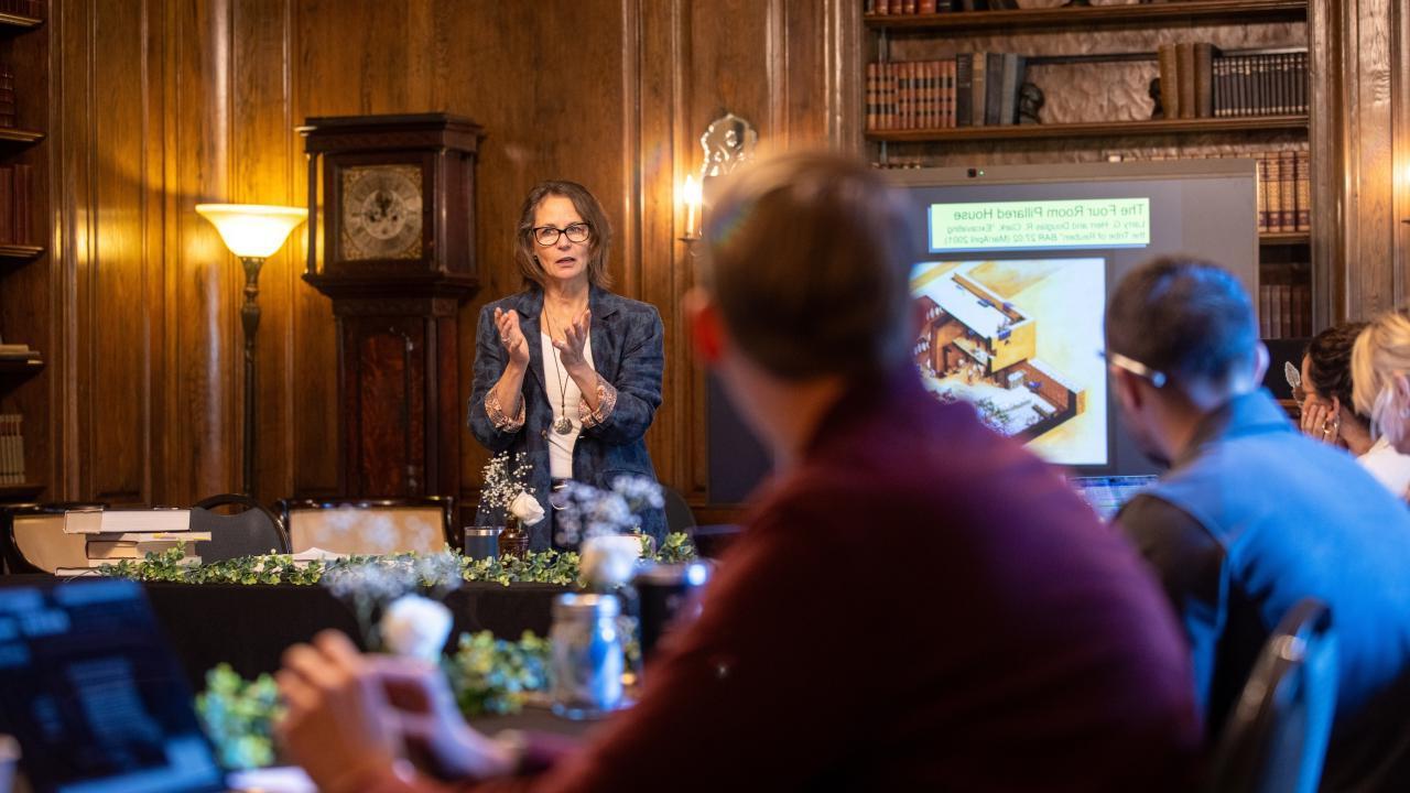 Sandy speaking to a group 